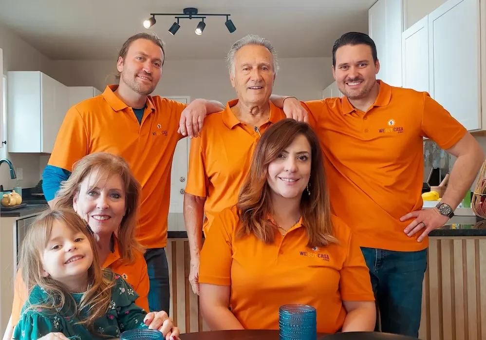 We Buy Casa team standing inside a remodeled El Paso home they purchased and sold for cash, helping a homeowner avoid foreclosure