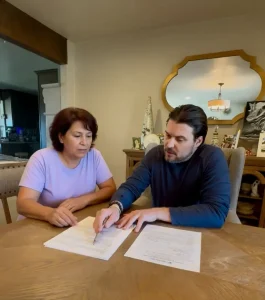 Evan Karam meeting with an El Paso homeowner to discuss foreclosure options and selling their house.