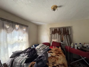 Vacant bedroom inside an El Paso home before it was sold as-is.